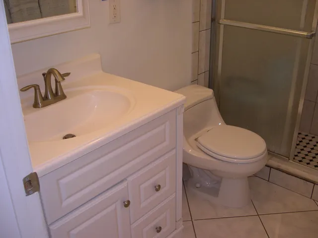 a bathroom with a toilet and a sink