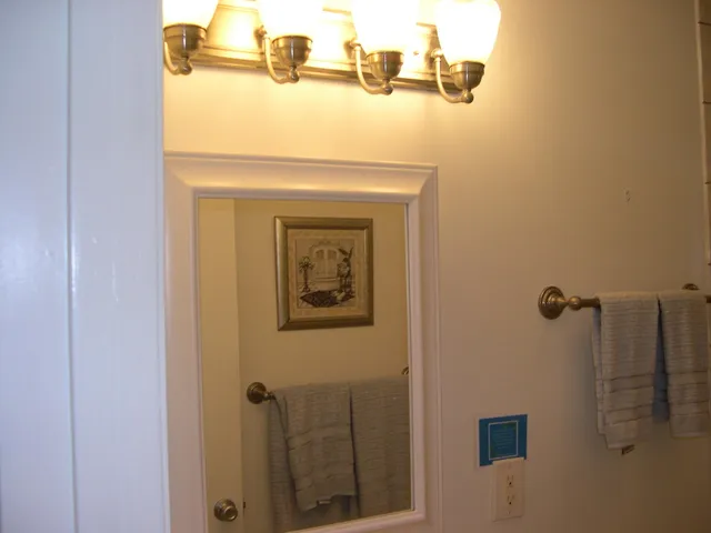 a close view of a utility room with mirror