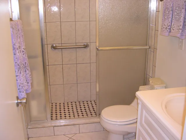 a living room with furniture and a lamp