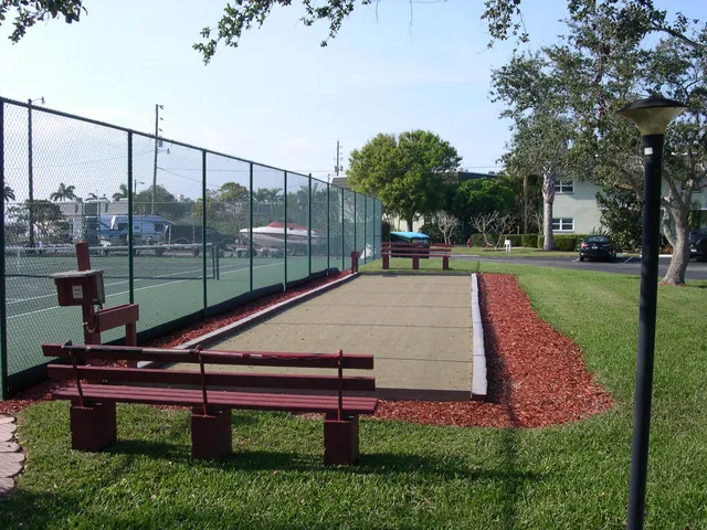a view of a lake with boats next to a bridge
