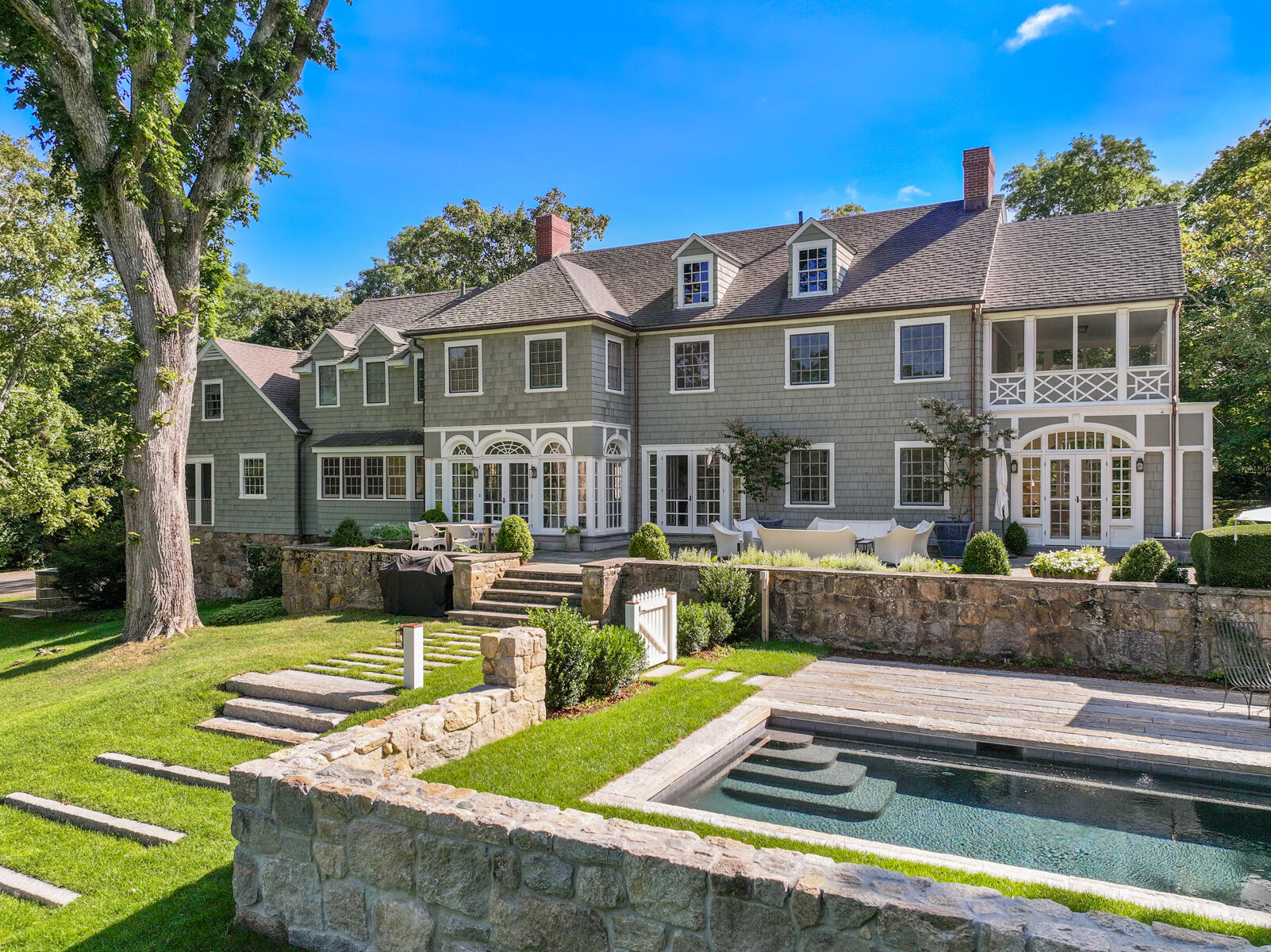 503 Sippewissett Road Falmouth, MA 02540 - Photo 1 of 45 a front view of a house with swimming pool and porch