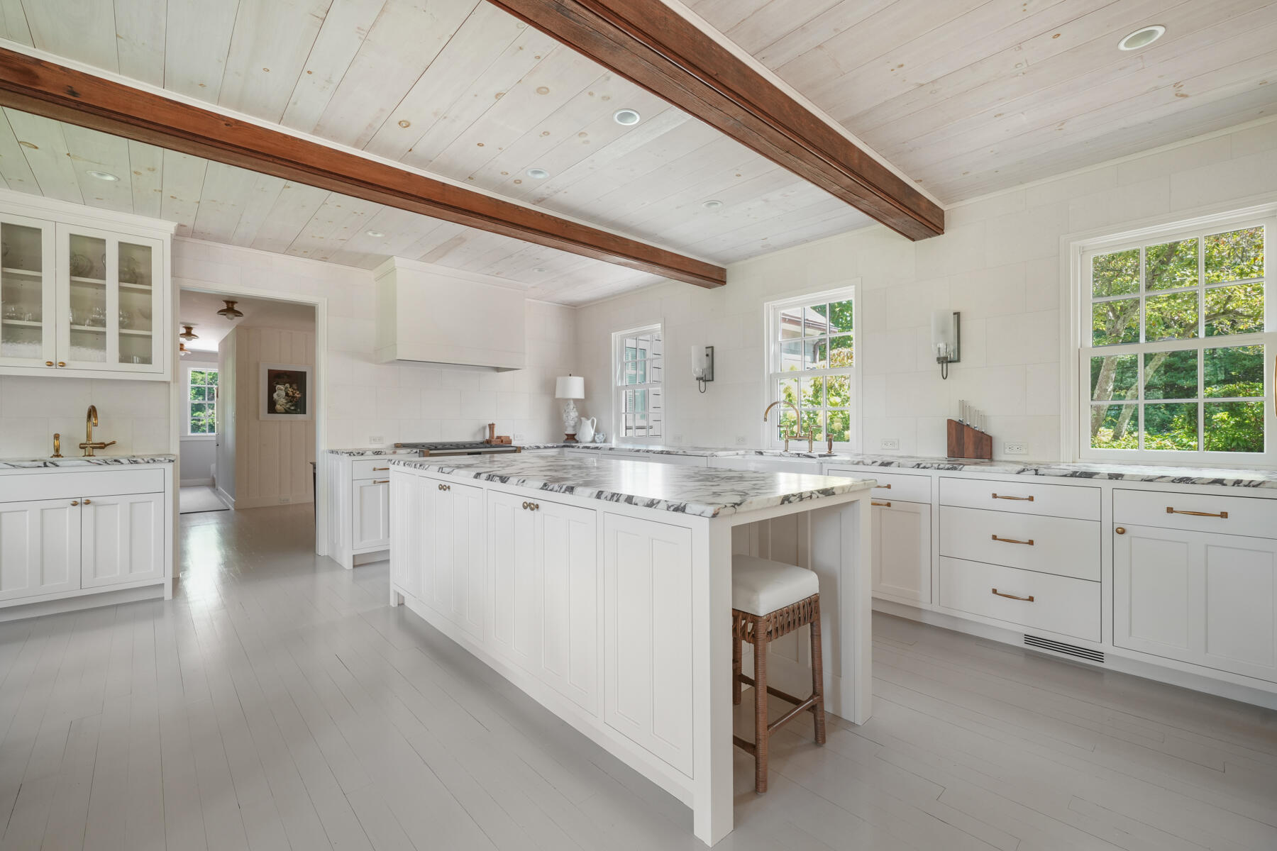 503 Sippewissett Road Falmouth, MA 02540 - Photo 17 of 45 a large kitchen with kitchen island white cabinets and white appliances