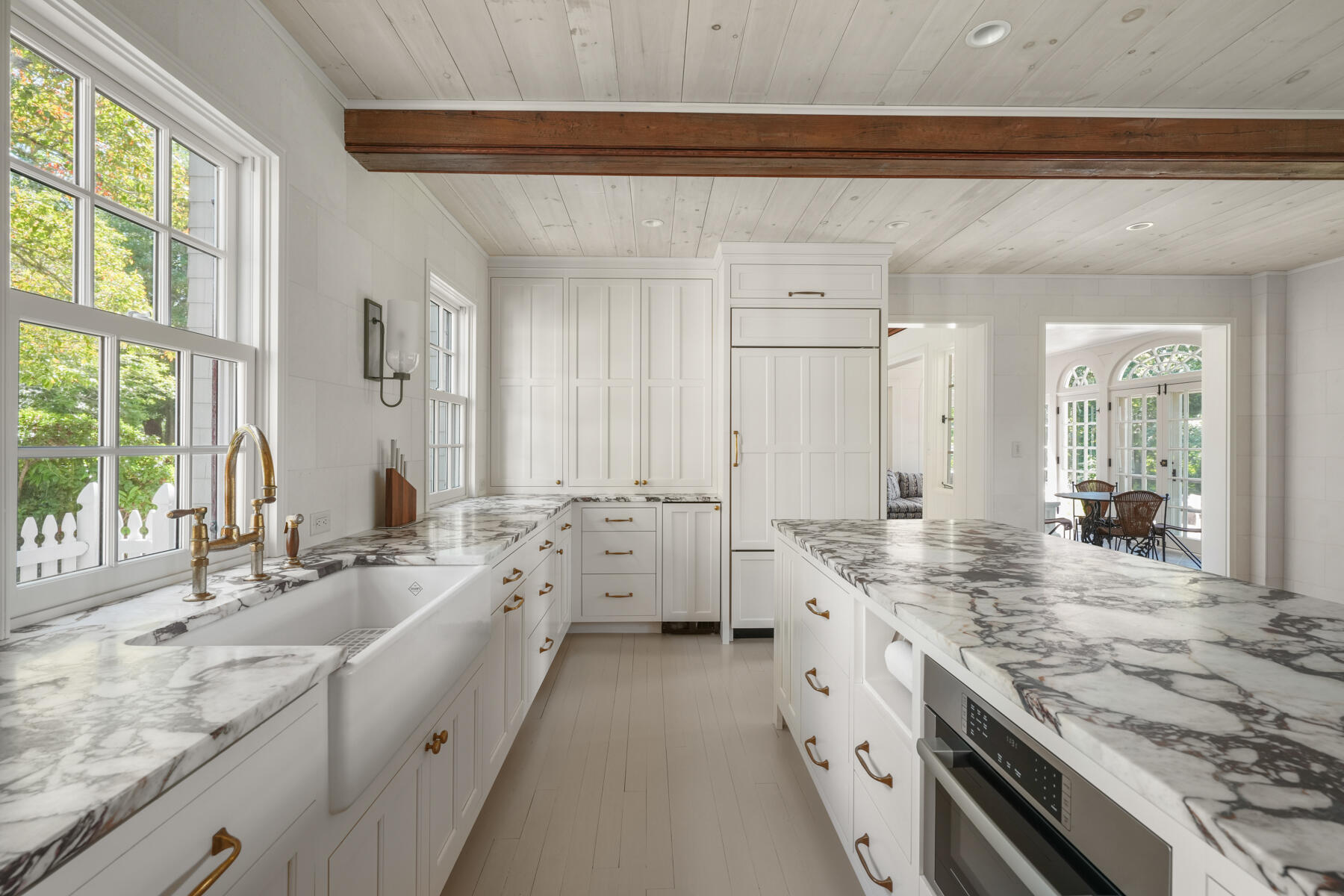 503 Sippewissett Road Falmouth, MA 02540 - Photo 20 of 45 a large white kitchen with granite countertop a large window