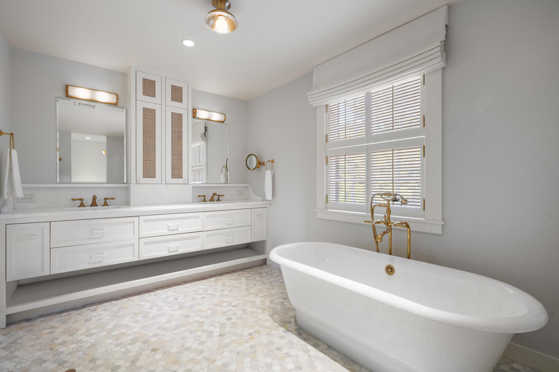 503 Sippewissett Road Falmouth, MA 02540 - Photo 27 of 45 a bathroom with a bathtub a sink and a window