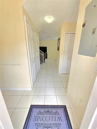 a view of entryway with furniture and a window
