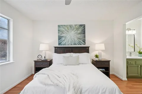 a bedroom with a bed and a lamp