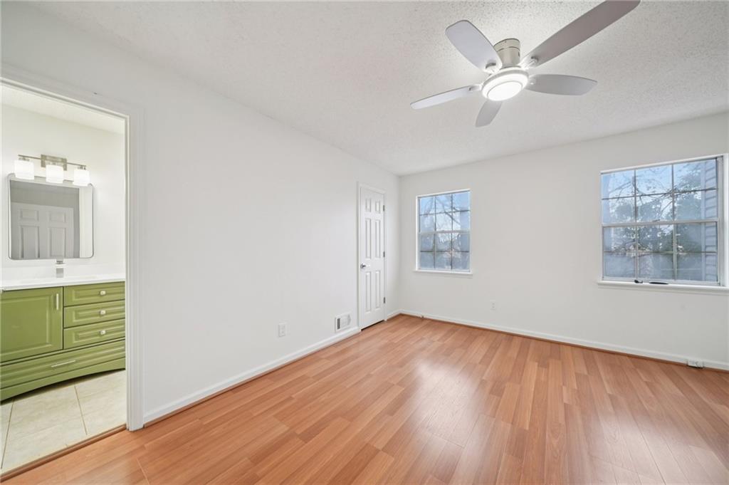 1750 Clairmont Road, Unit 8 Decatur, GA 30033 - Photo 19 of 28 wooden floor in an empty room with a window