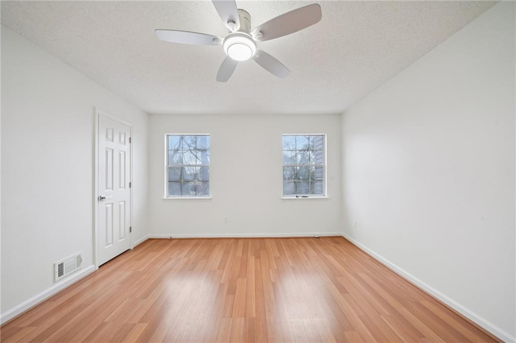 1750 Clairmont Road, Unit 8 Decatur, GA 30033 - Photo 20 of 28 wooden floor in an empty room with a window