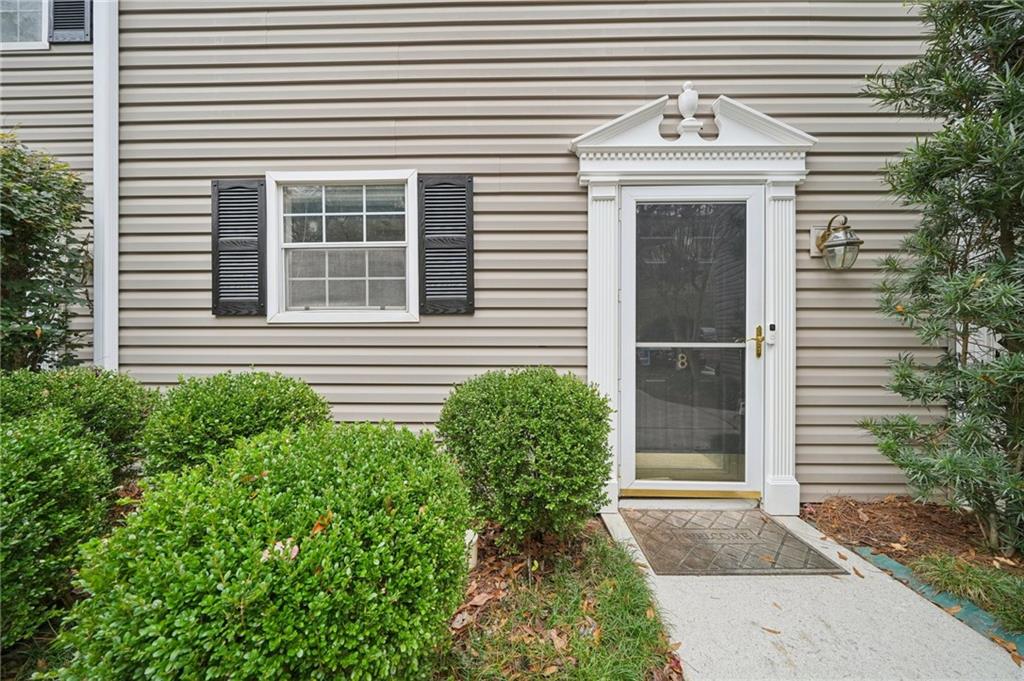 1750 Clairmont Road, Unit 8 Decatur, GA 30033 - Photo 2 of 28 a front view of a house with garden