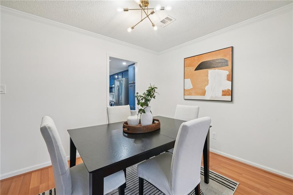 1750 Clairmont Road, Unit 8 Decatur, GA 30033 - Photo 9 of 28 a dining room with furniture and wooden floor