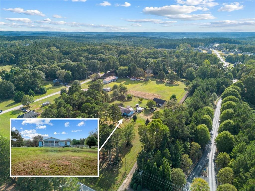 5570 Bold Springs Road Dacula, GA 30019 - Photo 12 of 60 an aerial view of residential houses with outdoor space and swimming pool