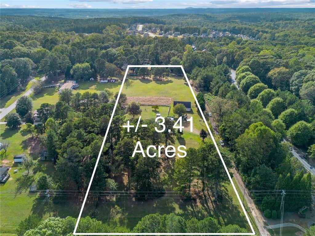 5570 Bold Springs Road Dacula, GA 30019 - Photo 14 of 60 a view of a back yard with a garden