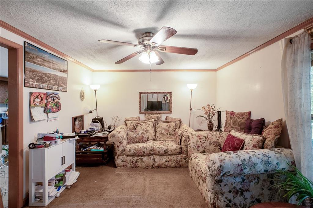 5570 Bold Springs Road Dacula, GA 30019 - Photo 20 of 60 a living room with furniture and a flat screen tv
