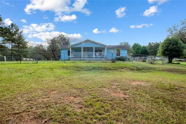 a view of a house with a big yard