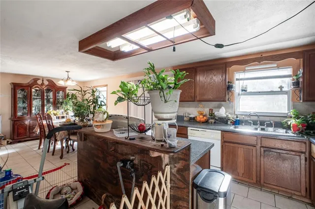 a bathroom with a sink a mirror and a shower