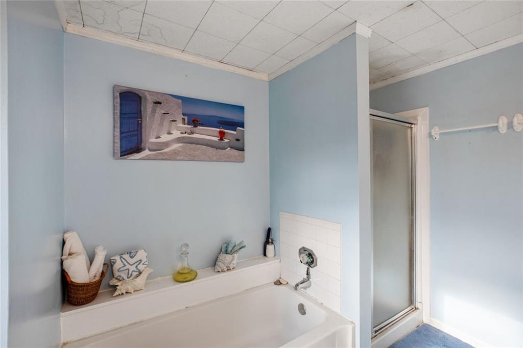 5570 Bold Springs Road Dacula, GA 30019 - Photo 28 of 60 a bathroom with a tub and sink