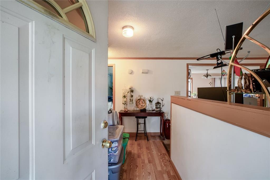 5570 Bold Springs Road Dacula, GA 30019 - Photo 34 of 60 a view of a livingroom with furniture and hardwood floor