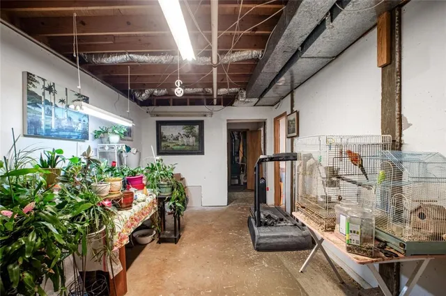 a view of dirt yard with green space