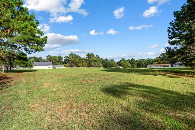 a view of a house with a big yard