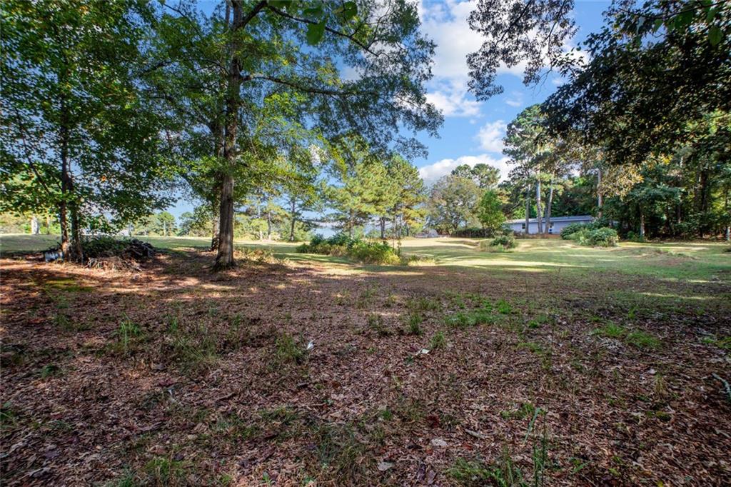 5570 Bold Springs Road Dacula, GA 30019 - Photo 46 of 60 a view of dirt yard with green space
