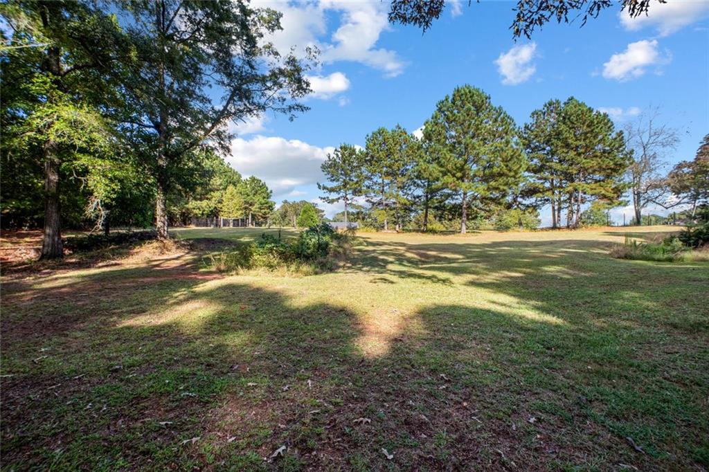 5570 Bold Springs Road Dacula, GA 30019 - Photo 47 of 60 a view of a yard with an outdoor space