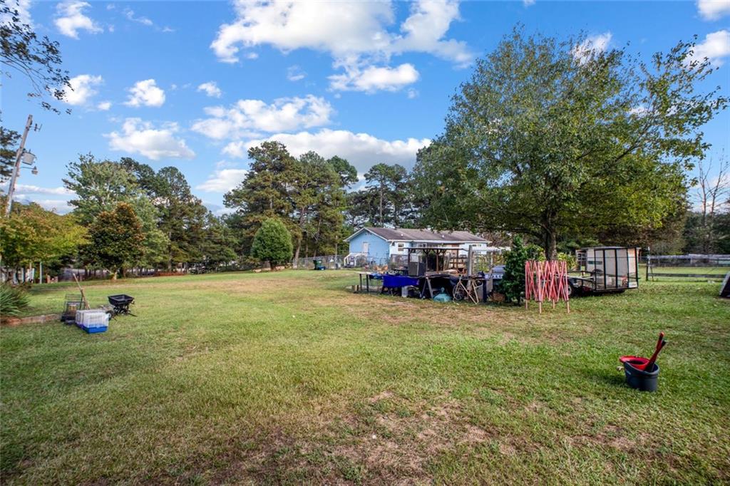 5570 Bold Springs Road Dacula, GA 30019 - Photo 56 of 60 a view of a house with backyard