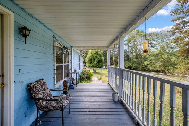 a view of a balcony with chairs