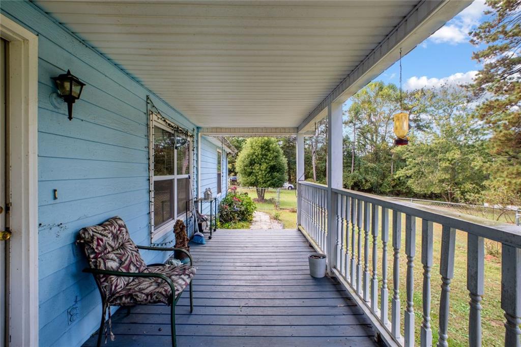 5570 Bold Springs Road Dacula, GA 30019 - Photo 7 of 60 a view of a balcony with chairs