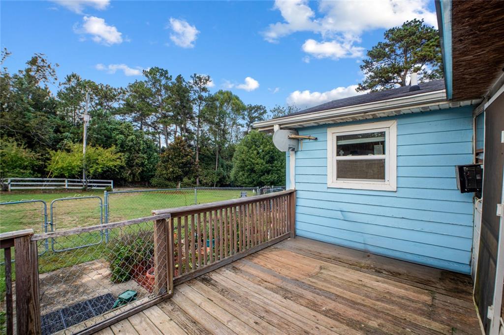5570 Bold Springs Road Dacula, GA 30019 - Photo 8 of 60 a view of a deck with a yard