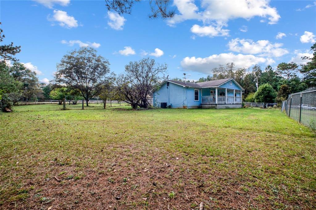 5570 Bold Springs Road Dacula, GA 30019 - Photo 10 of 60 a view of a house with a big yard