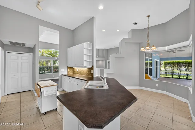 a large bathroom with a granite countertop sink a mirror and a shower