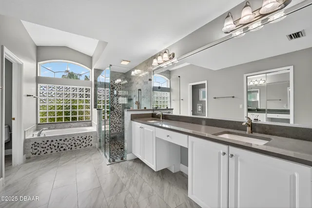 a view of a house with backyard and porch
