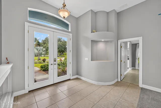 a view of a center island wooden floor and a living room