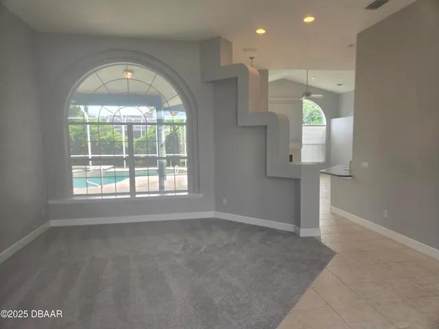 a kitchen with stainless steel appliances granite countertop a stove a sink and a white cabinets