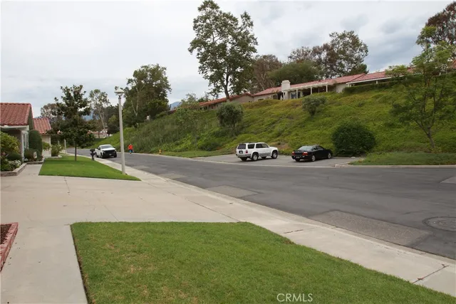 a view of a room with wooden floor and window