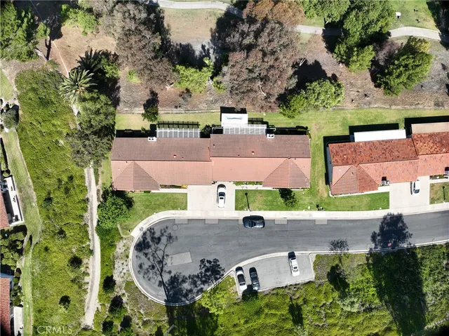an aerial view of a house with outdoor space