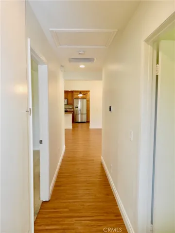 a view of a swimming pool with a patio and a garden