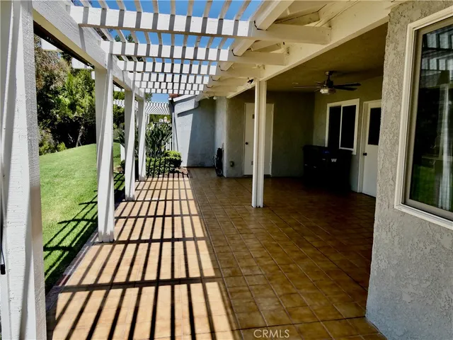 swimming pool view with a seating space and a lake view