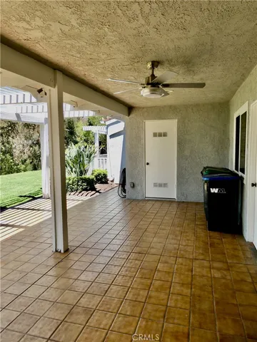 a view of a chairs and table on the balcony