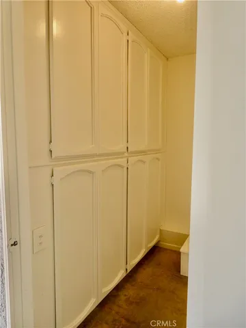 an aerial view of a house with outdoor space and seating area