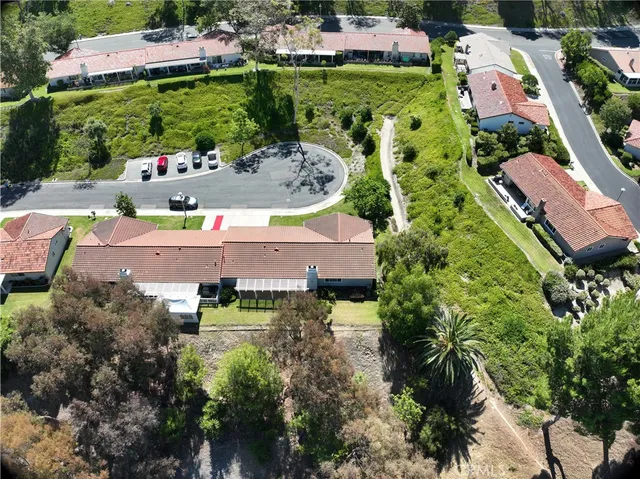 a view of house that has a yard