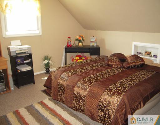 18 Racetrack Road East Brunswick, NJ 08816 - Photo 7 of 13 a bedroom with a bed and a closet