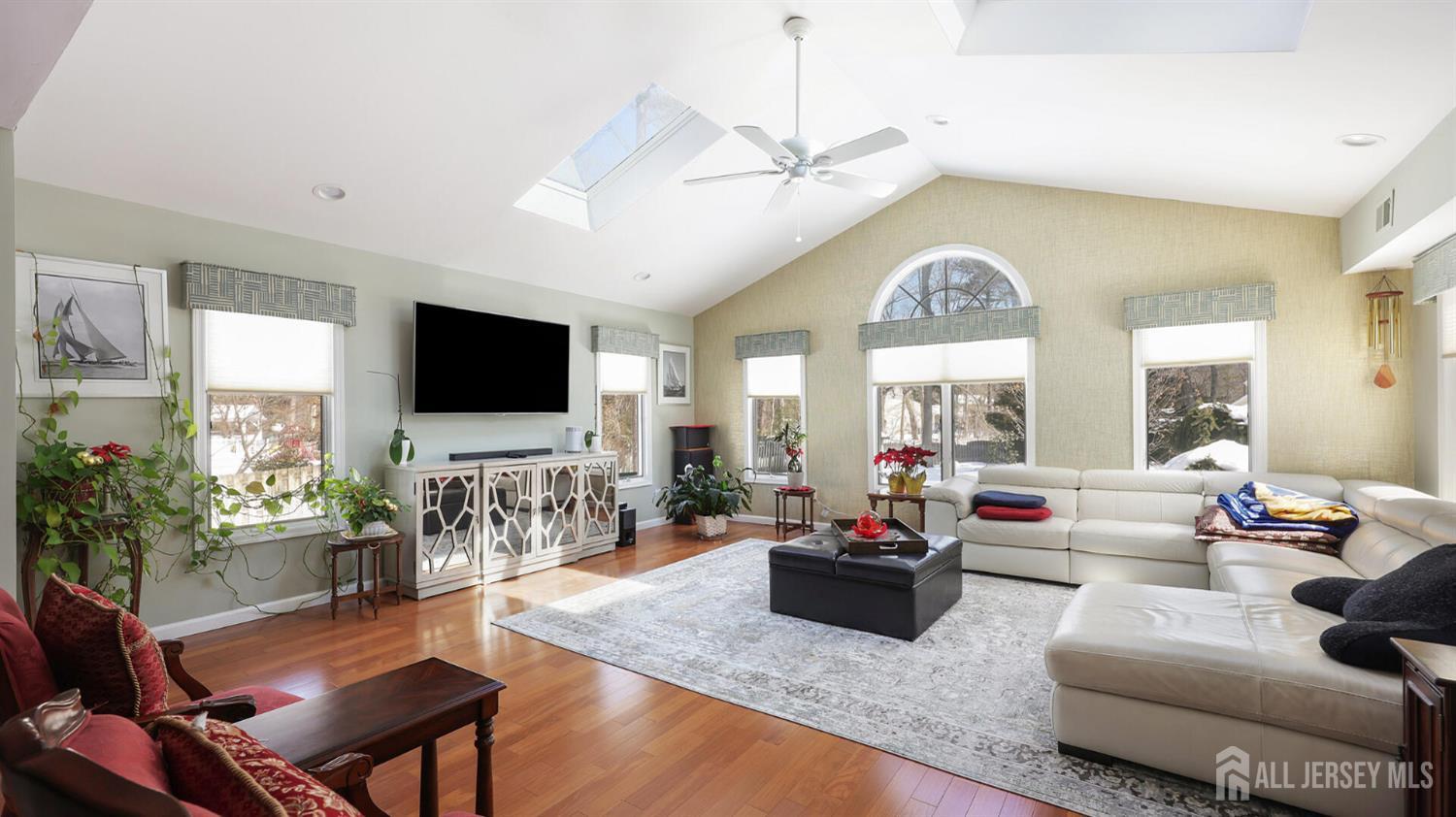 142 Monmouth Road Monroe Township, NJ 08831 - Photo 11 of 33 a living room with fireplace furniture and a flat screen tv