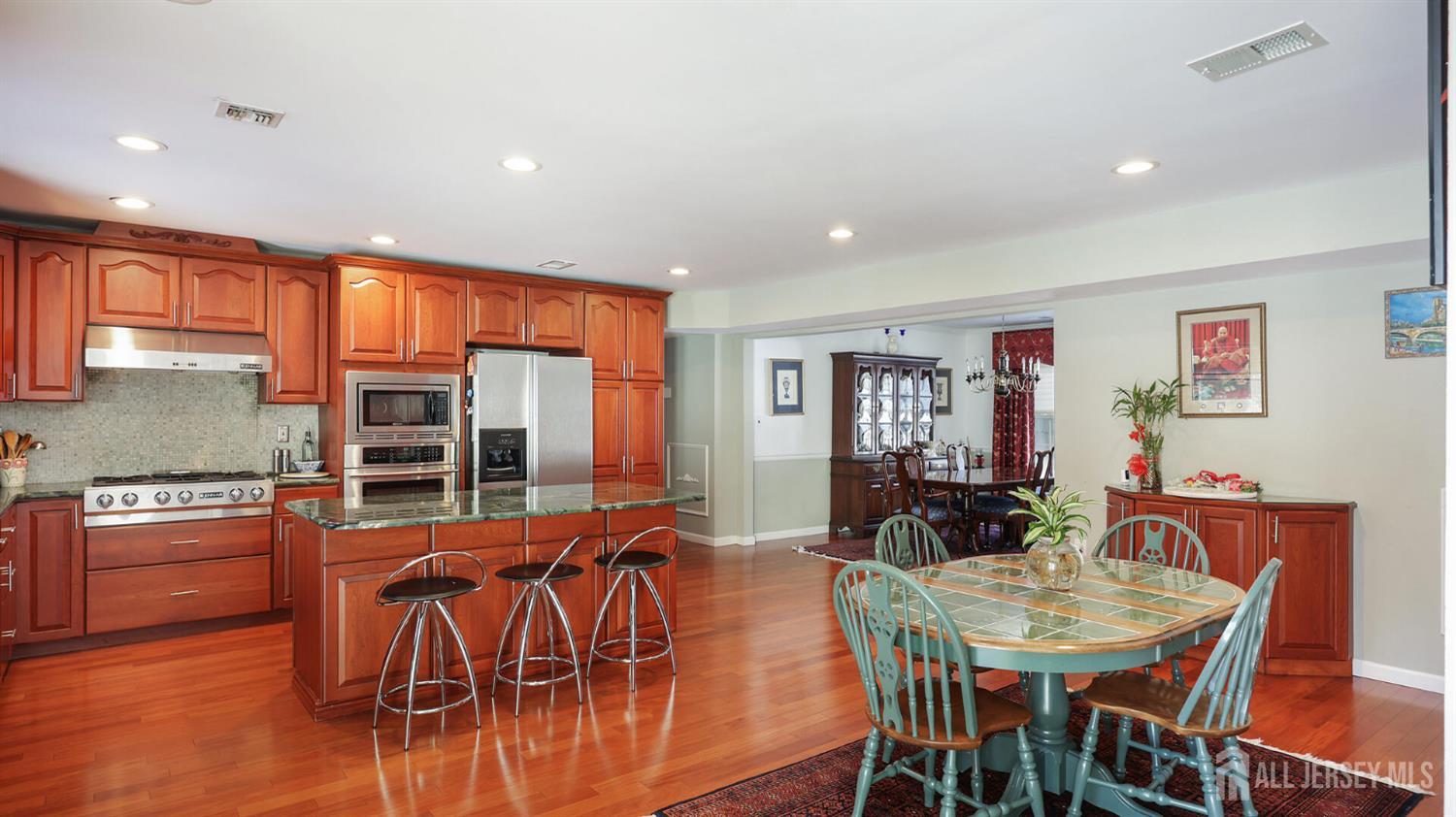 142 Monmouth Road Monroe Township, NJ 08831 - Photo 13 of 33 a view of a dining room with furniture window and wooden floor