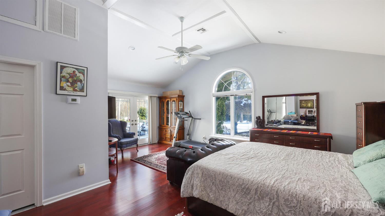 142 Monmouth Road Monroe Township, NJ 08831 - Photo 17 of 33 a spacious bedroom with a large bed and a large window
