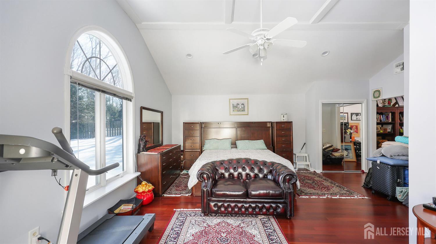 142 Monmouth Road Monroe Township, NJ 08831 - Photo 18 of 33 a bedroom with a bed mirror and a window