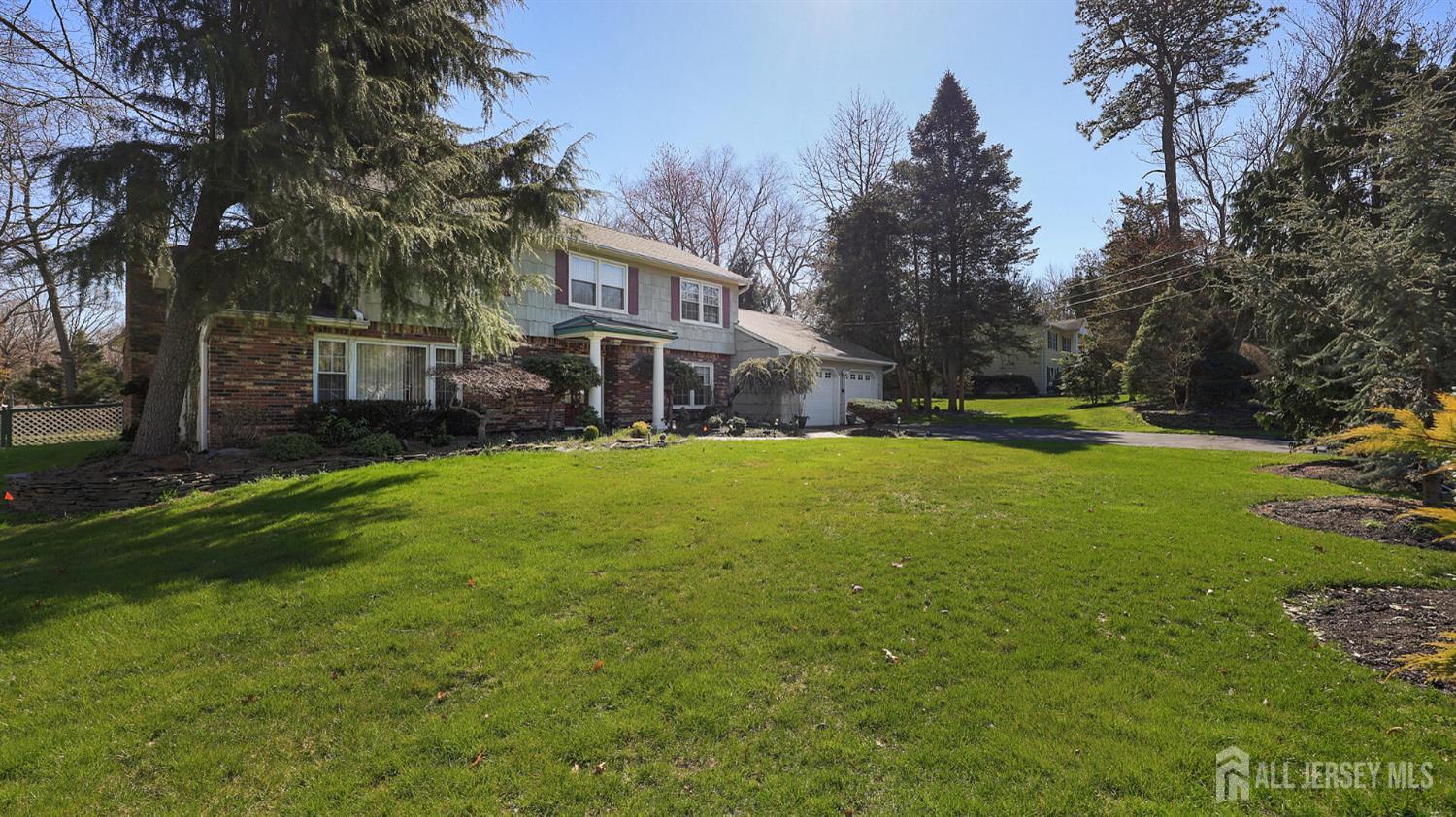 142 Monmouth Road Monroe Township, NJ 08831 - Photo 2 of 33 a view of a house with a yard and sitting area