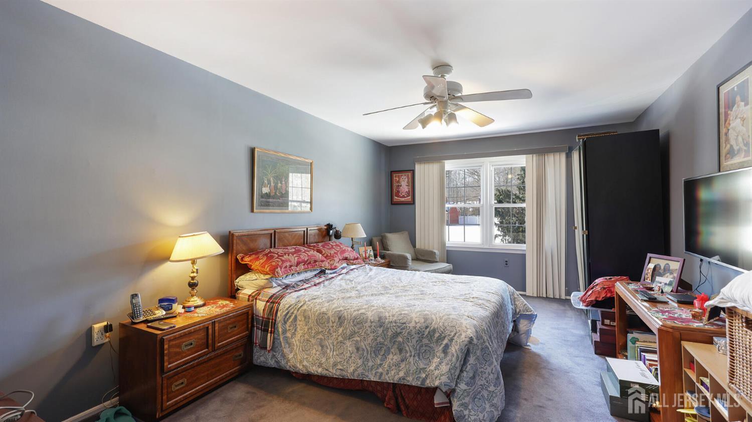 142 Monmouth Road Monroe Township, NJ 08831 - Photo 22 of 33 a bedroom with a bed and furniture