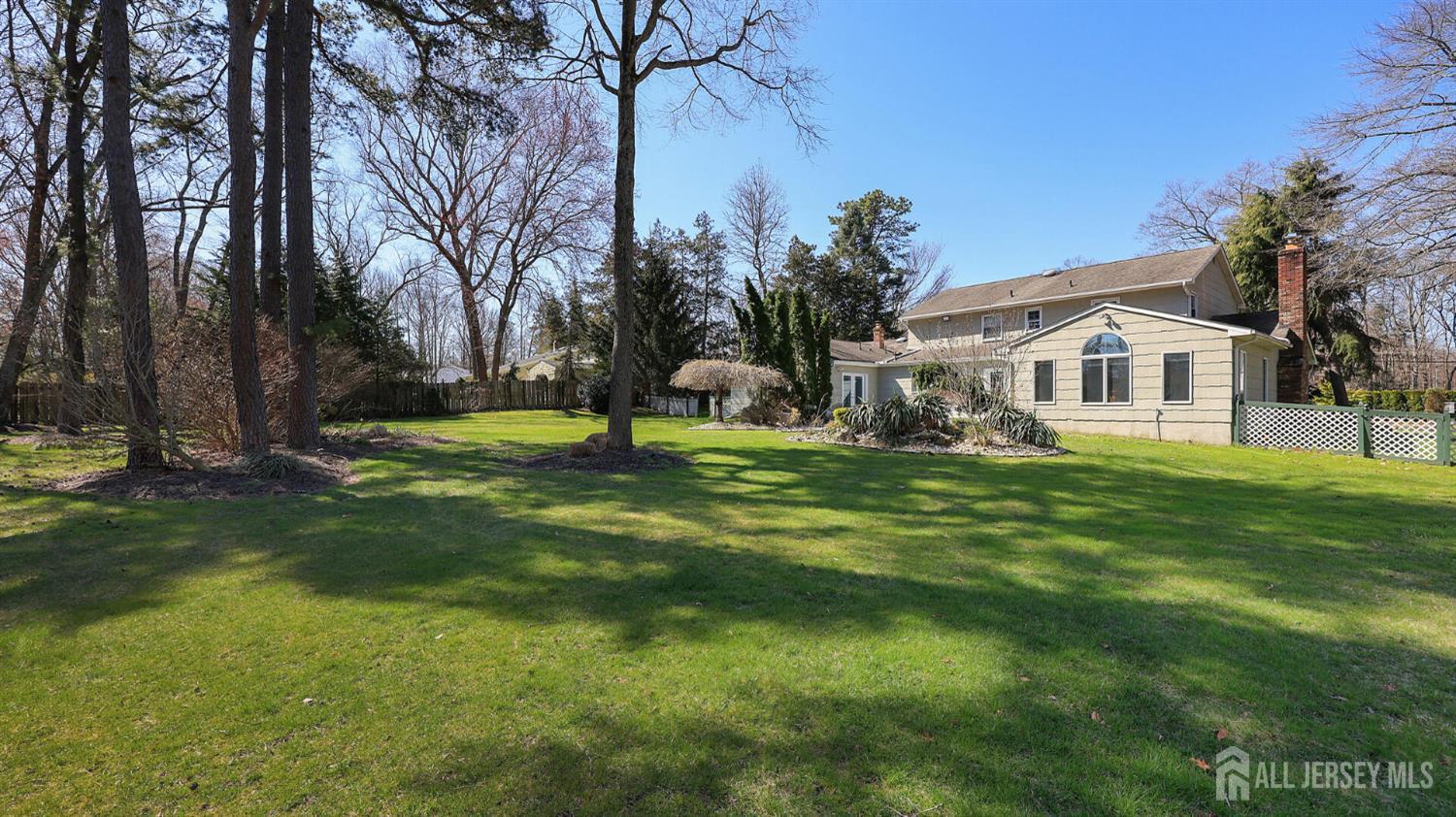 142 Monmouth Road Monroe Township, NJ 08831 - Photo 26 of 33 a front view of a house with a garden