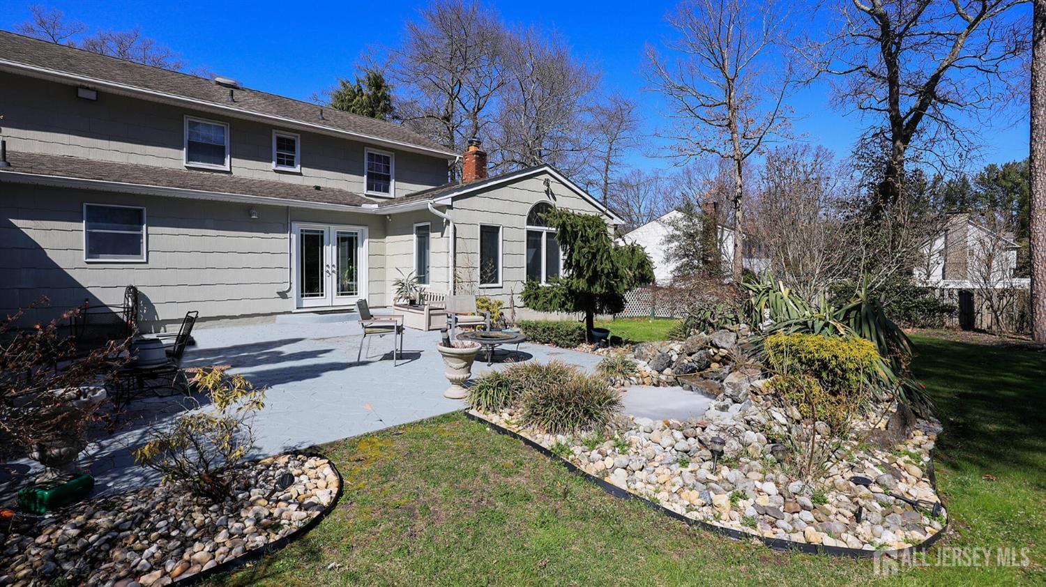 142 Monmouth Road Monroe Township, NJ 08831 - Photo 27 of 33 a front view of a house with garden
